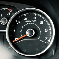 Detailed image of a car RPM gauge, showcasing vehicle control elements.