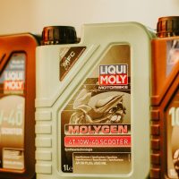Liqui Moly motorbike oil containers on display, photographed in a store setting in Jakarta.